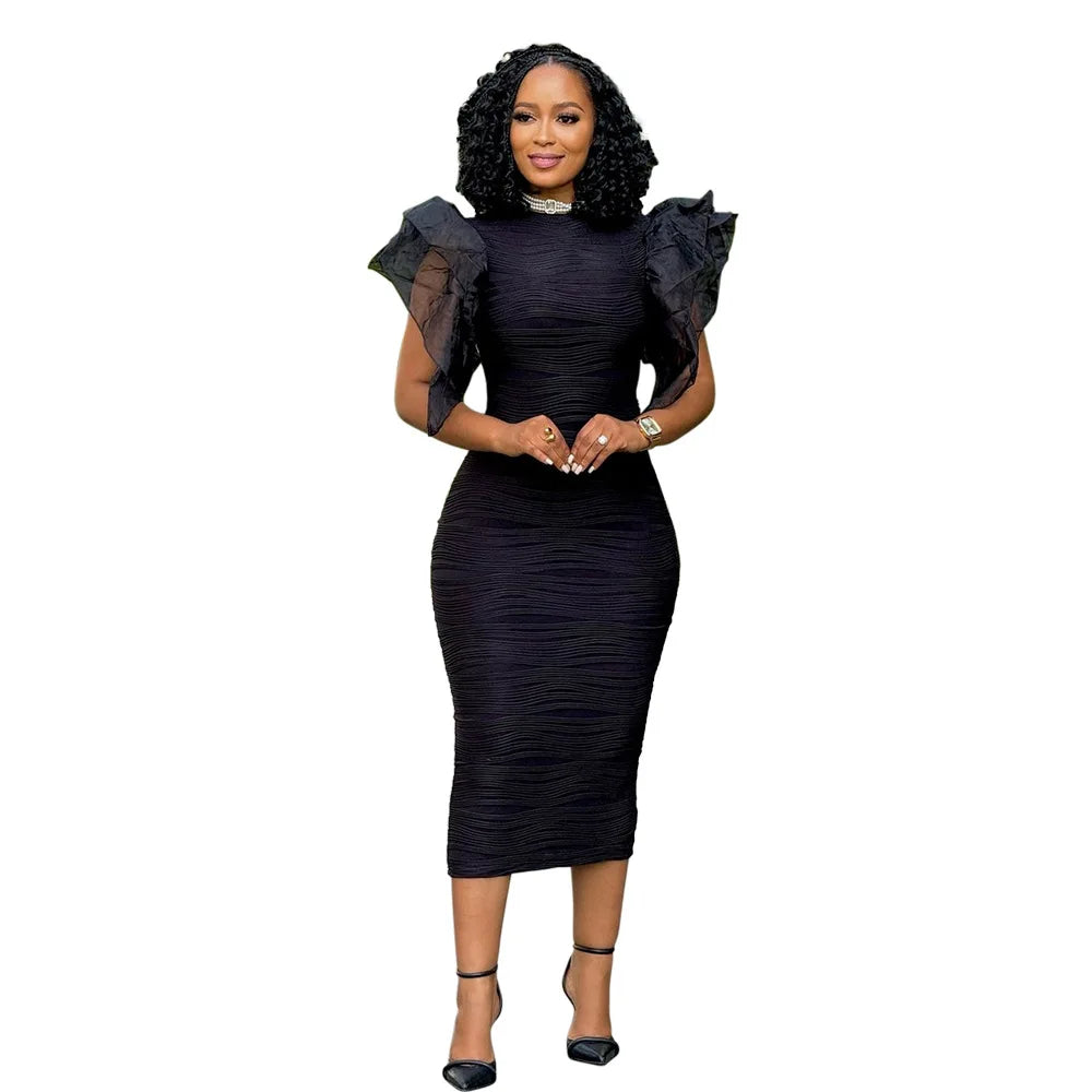 Sophisticated CM.YAYA dress featuring mid-calf length and stylish patchwork detail, ideal for spring and summer occasions.