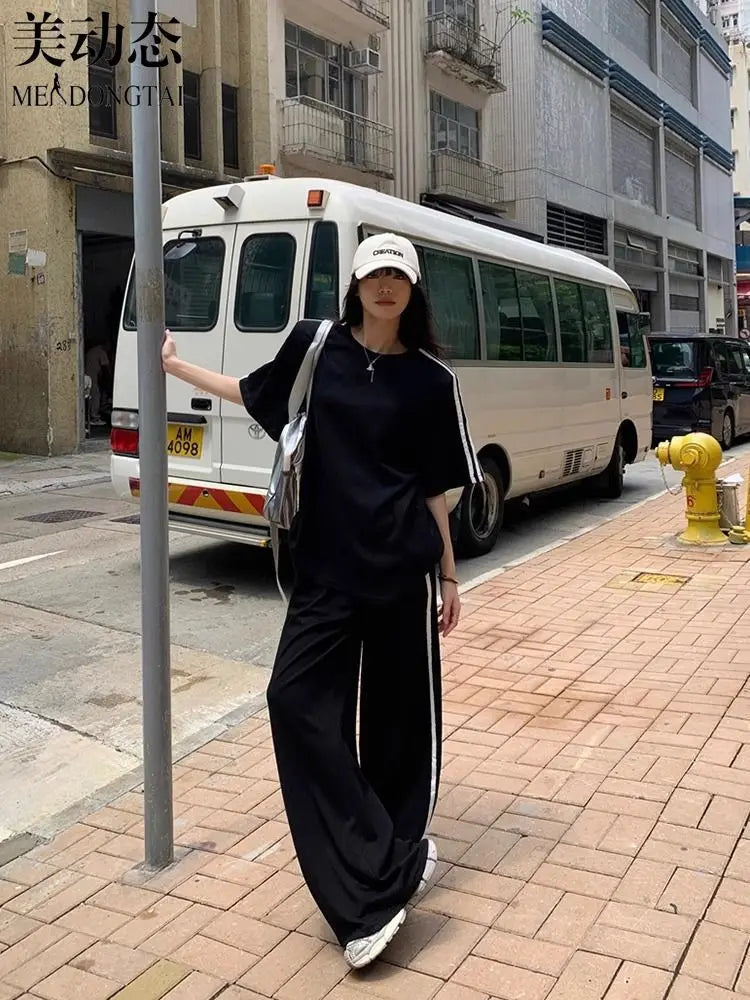Close-up of the luxurious fabric of the women's striped T-shirt, highlighting its medium stretch and quality cotton material.