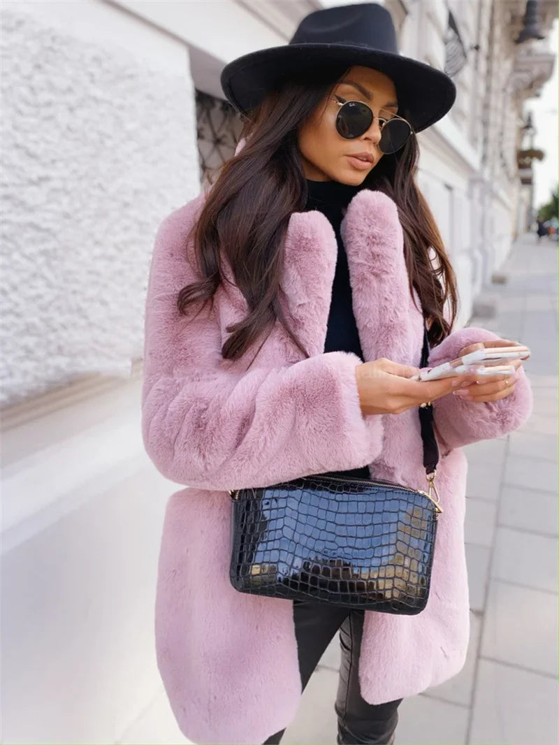 Elegant luxury women's long sleeve faux fur coat with lapel collar, perfect for winter fashion, featuring deep pockets and a covered button closure.