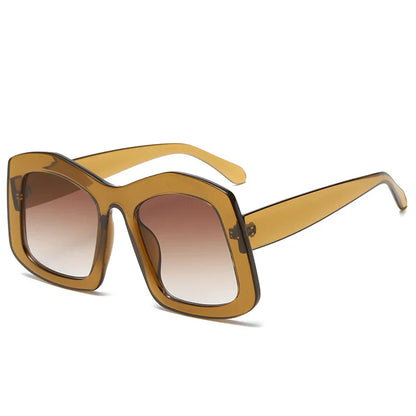 Stylish women's gradient orange oversized sunglasses, offering UV400 protection, made from premium polycarbonate for a luxurious look.