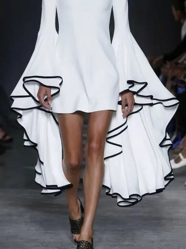 Close-up of the exquisite detail on a women's A-line mini dress, showcasing flared sleeves and a refined stand collar in a luxurious autumn-inspired design.