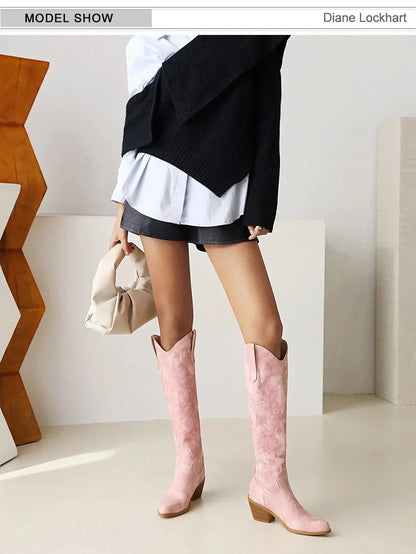 Stylish women's brown knee-high pointed toe cowboy boots, highlighting luxurious PU leather and a modern slip-on closure, ideal for fashionable casual outings.