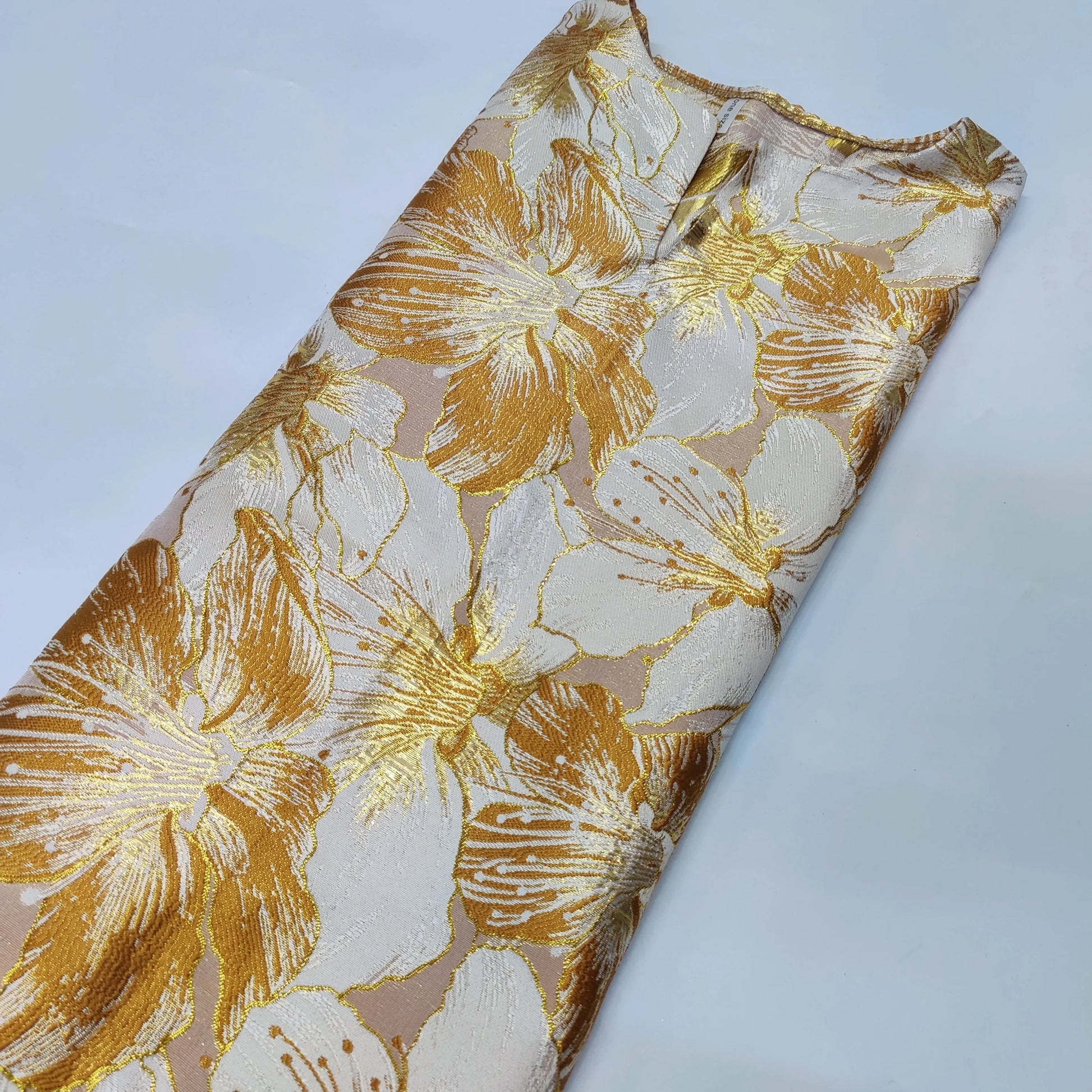 Opulent gold party dress for women, crafted from high-quality materials with traditional African design elements, perfect for celebrations and cultural events.