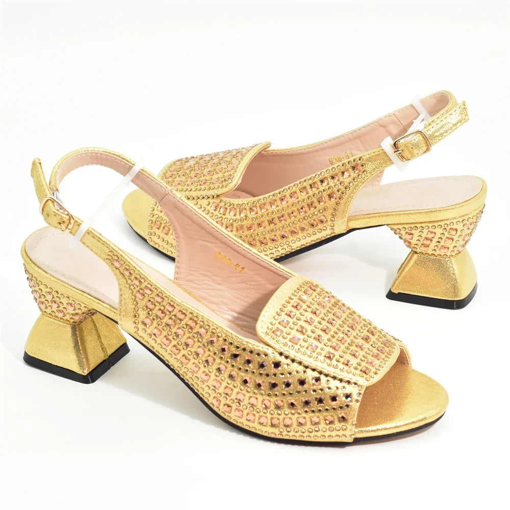 Luxurious matching handbag featuring chic rhinestone details, designed to complement high heel pumps.