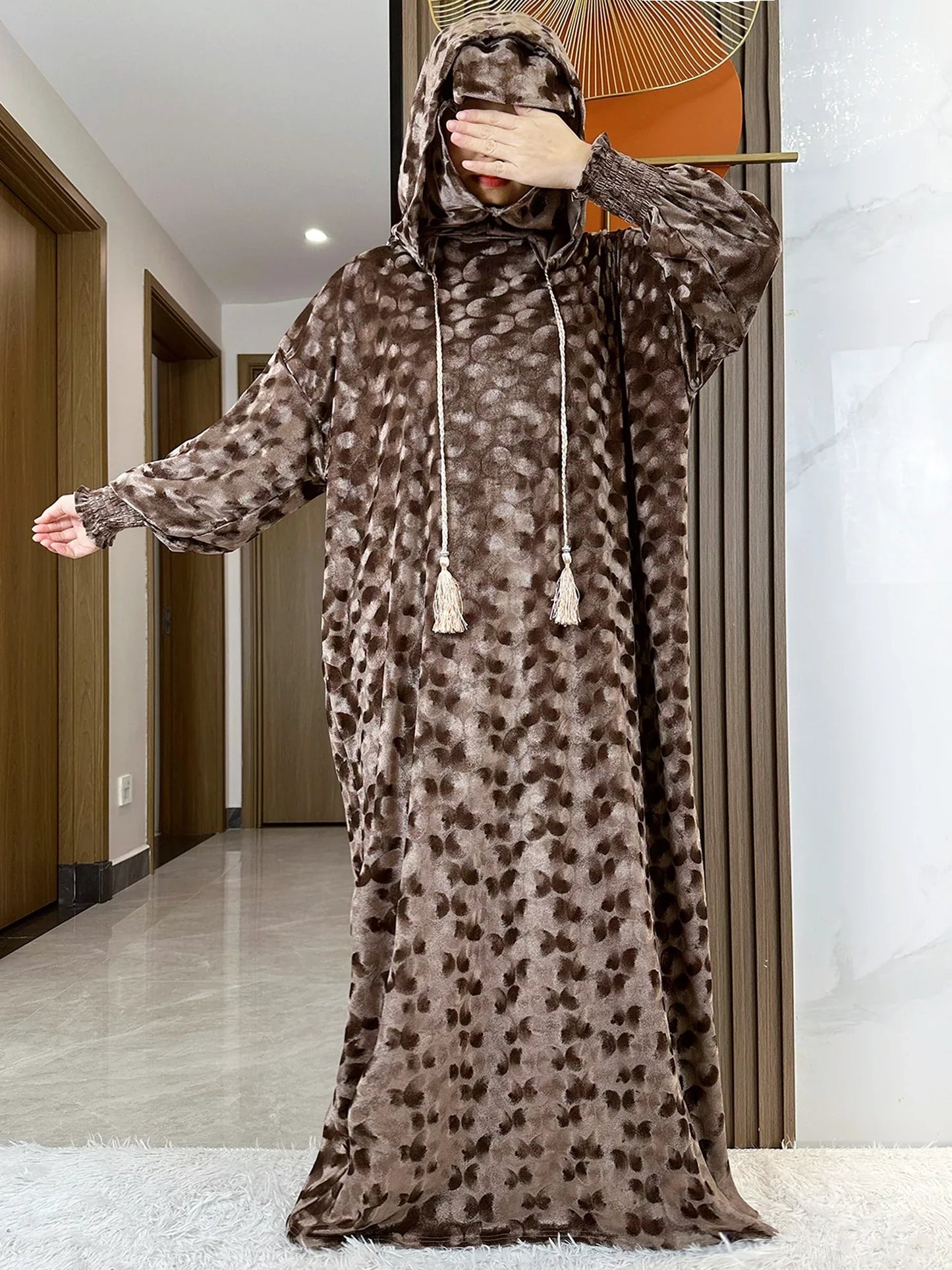 Loose fit luxury Muslim Abaya in rich velvet, a transcendent choice for middle-aged fashion, epitomizing elegance in Islamic clothing.