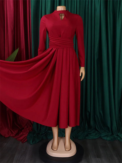 Atmospheric shot of Wmstar Plus Size Women's Ankara Dress at a party setting, exuding glamour and sophistication for the modern woman.