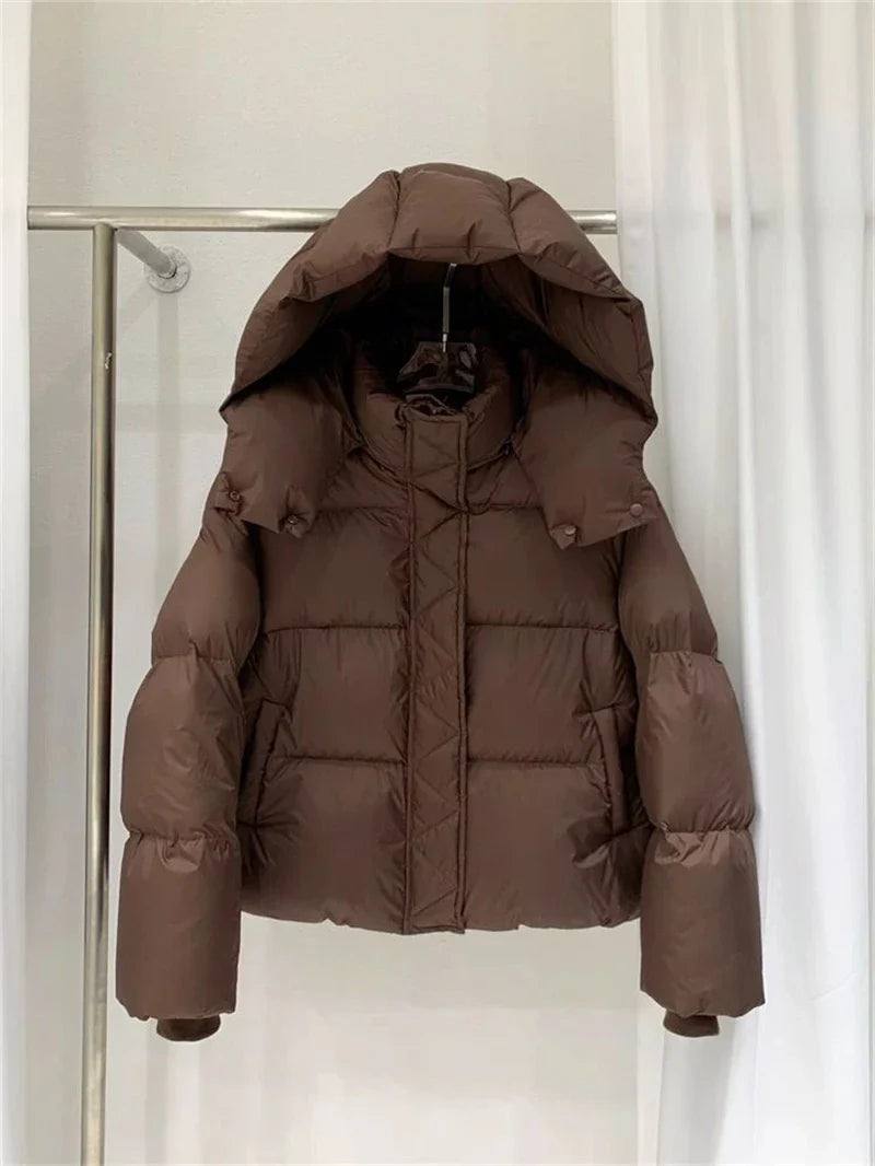 Refined women's urban winter outerwear, highlighting thick cotton filling and a contemporary cropped silhouette, perfect for elevating any casual ensemble.