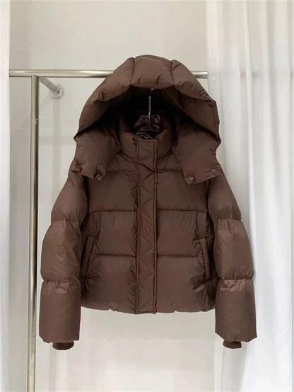 Refined women's urban winter outerwear, highlighting thick cotton filling and a contemporary cropped silhouette, perfect for elevating any casual ensemble.