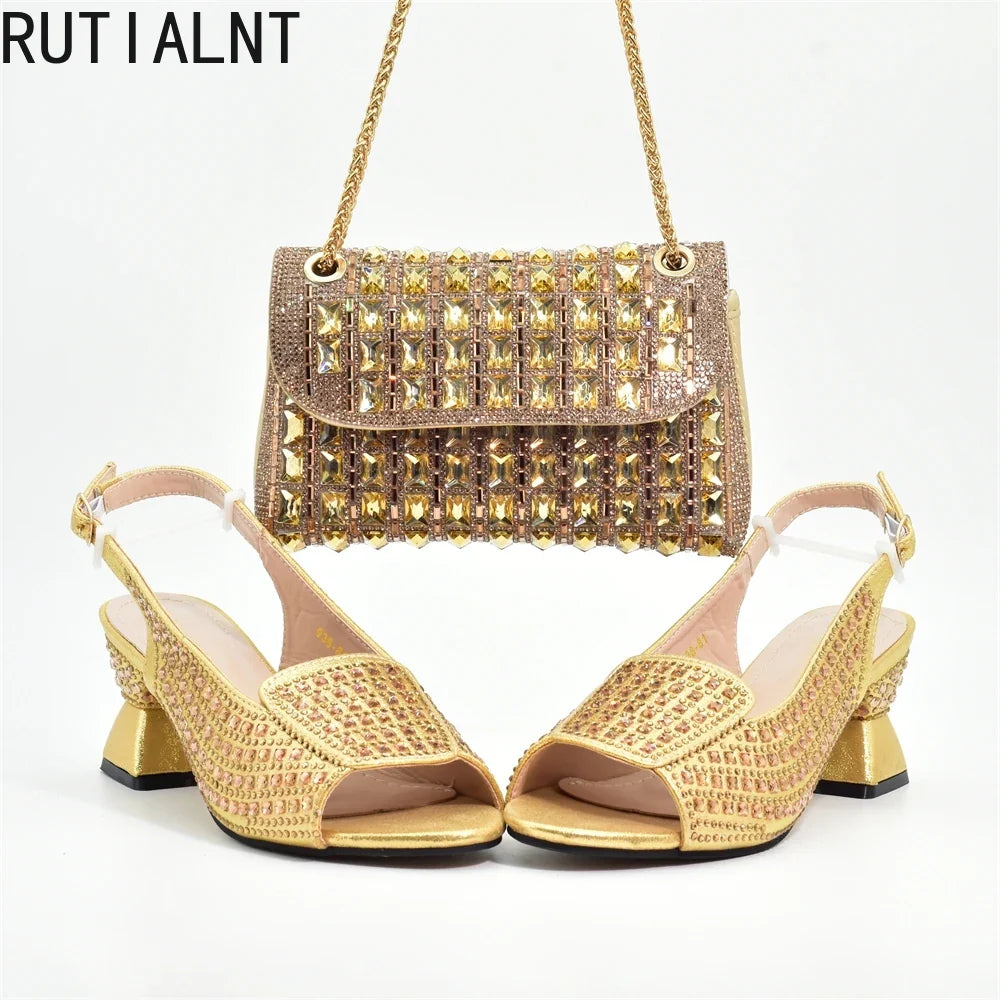 Elegant women's Italian high heel pumps adorned with rhinestones in classic black, part of a luxurious shoe and matching bag set, ideal for parties and weddings.