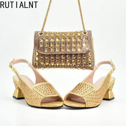 Elegant women's Italian high heel pumps adorned with rhinestones in classic black, part of a luxurious shoe and matching bag set, ideal for parties and weddings.