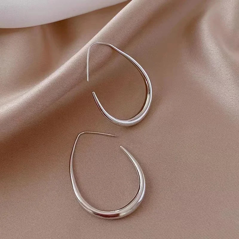 Classic water drop shape metal earrings for women, showcasing a luxurious design ideal for special occasions and stylish events.