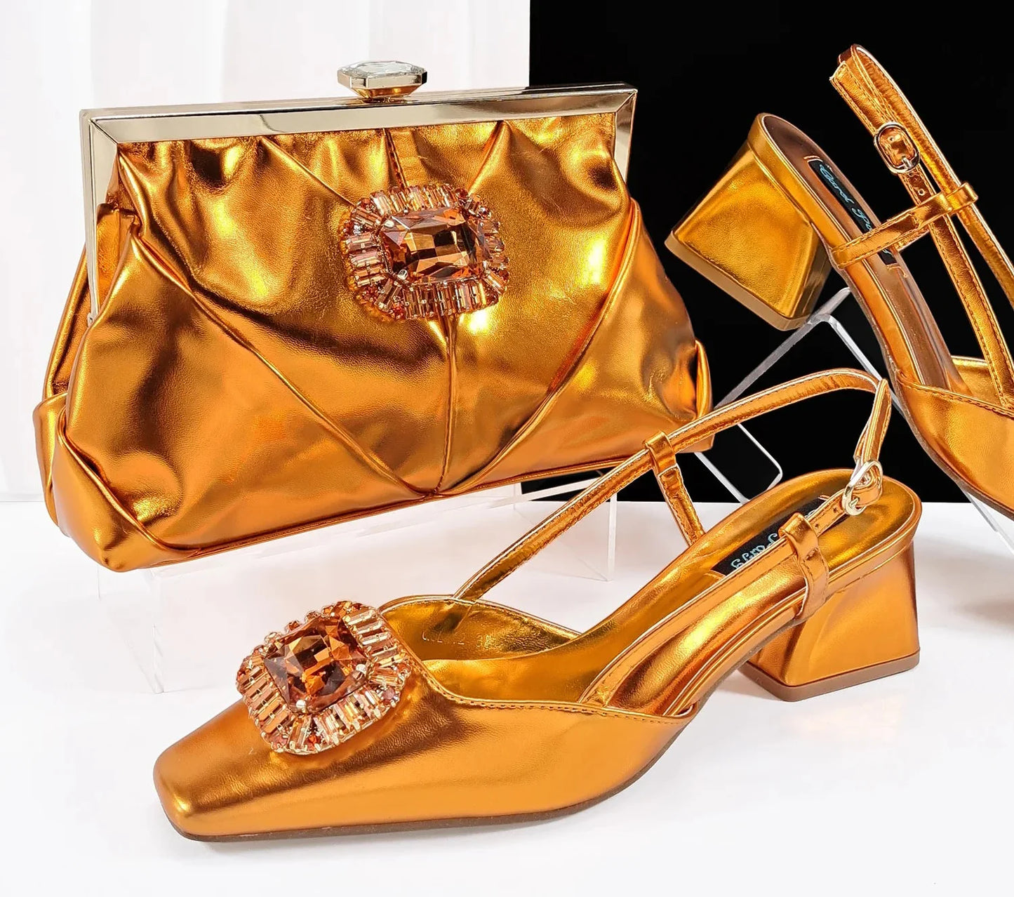 Full set display of luxury women's rhinestone pumps and handbag, perfect for fashion-forward individuals seeking glamorous style.