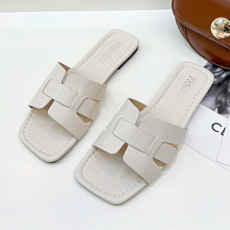 Trendy gladiator-style women’s sandals with flat heel, perfect for casual occasions and stylish walks.