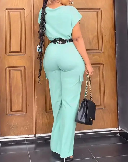 Close-up of the luxurious fabric of the women's geometric print two-piece set, highlighting the chic pullover style of the crop top and the sleek elasticity of the high waist pants.