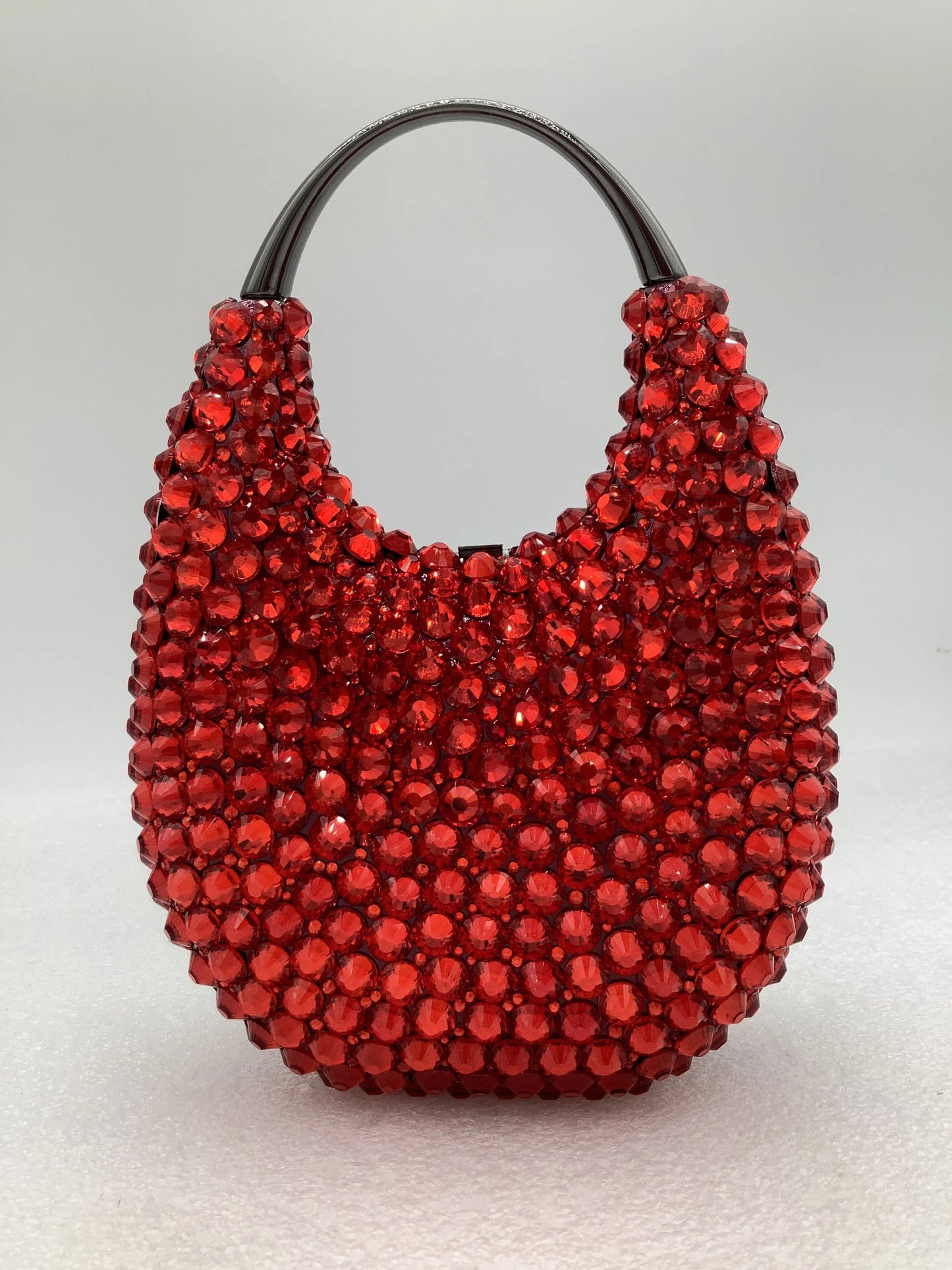 Elegant women's minaudiere evening clutch bag adorned with crystal diamonds, showcasing a luxurious metallic finish and secure hasp closure, perfect for evening parties.