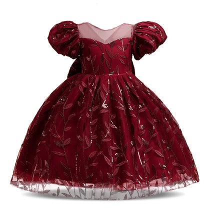 Charming back view of the girls' princess summer dress displaying the intricate bow detail, adding sophistication to any festive celebration.