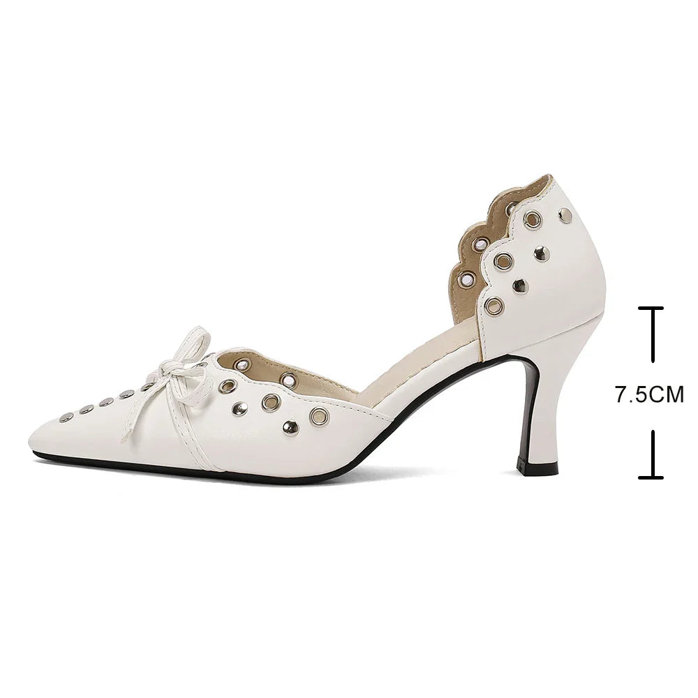 Front view of women's chic high heel sandals with eye-catching rivets and air holes, designed for a trendy summer outfit.