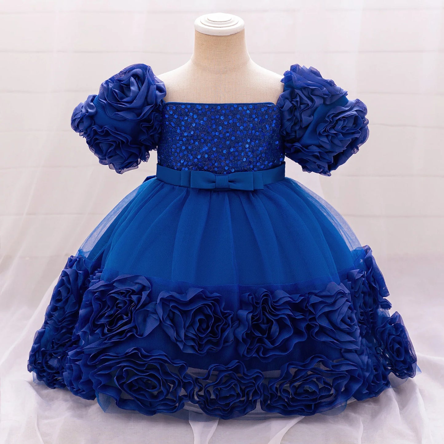 Beautiful royal blue tulle princess dress for girls aged 4 to 10, perfect for weddings and special events, enhancing elegance with floral accents.