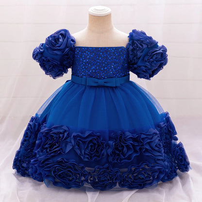 Beautiful royal blue tulle princess dress for girls aged 4 to 10, perfect for weddings and special events, enhancing elegance with floral accents.