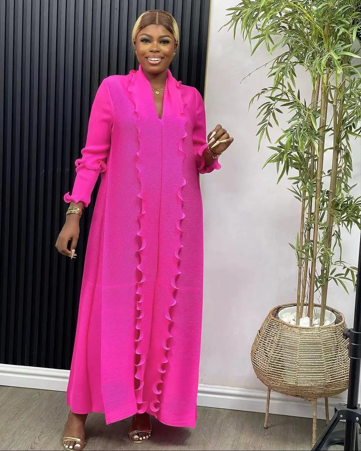 Luxury women's loose abaya dress with ruffle sleeves, elegant ankle length design, perfect for Eid celebrations.