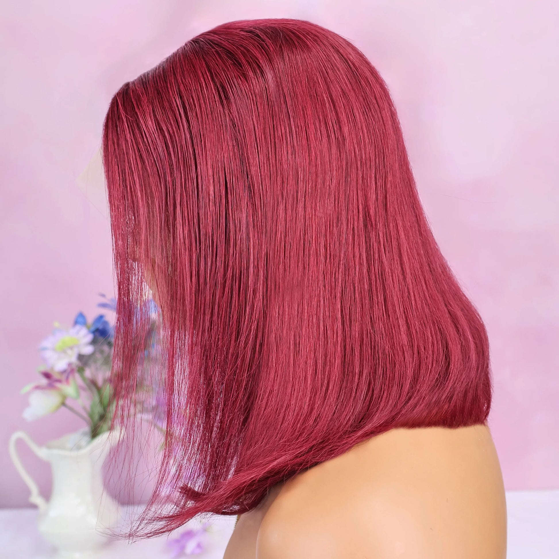 Stylish display of the 99J Burgundy Bob Straight Human Hair Wig, featuring a sleek design and rich colour, ideal for those seeking a sophisticated and glamorous look.