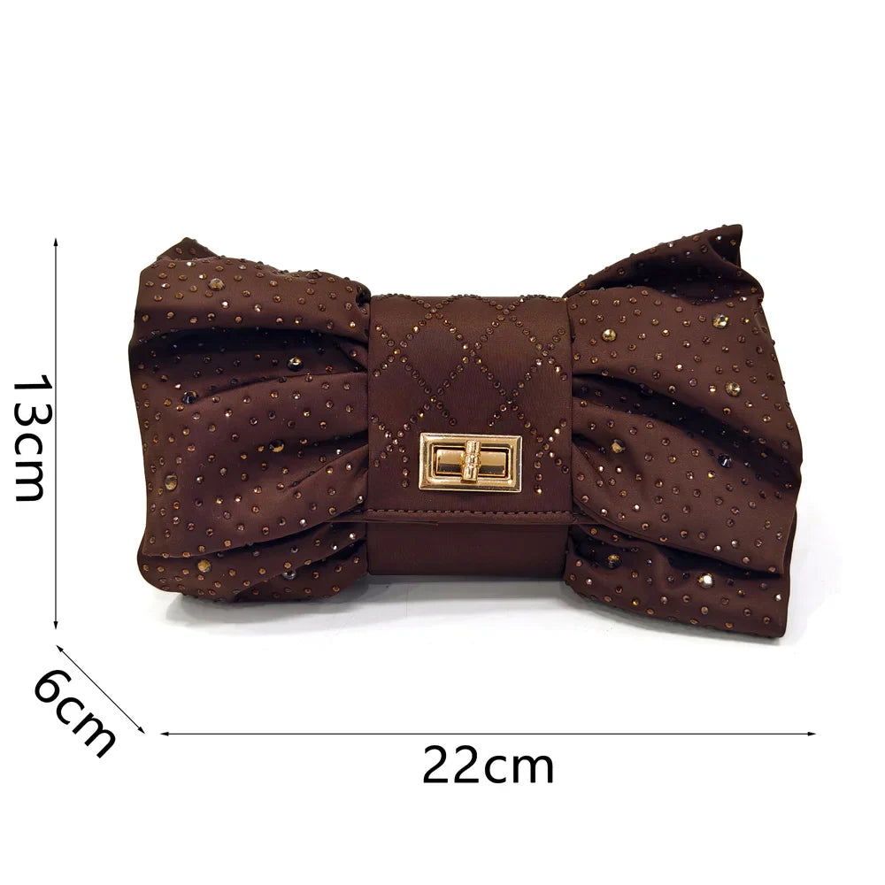 Chic matching bag featuring a sparkling diamond butterfly detail, perfectly complementing the elegant Italian slingback shoes.