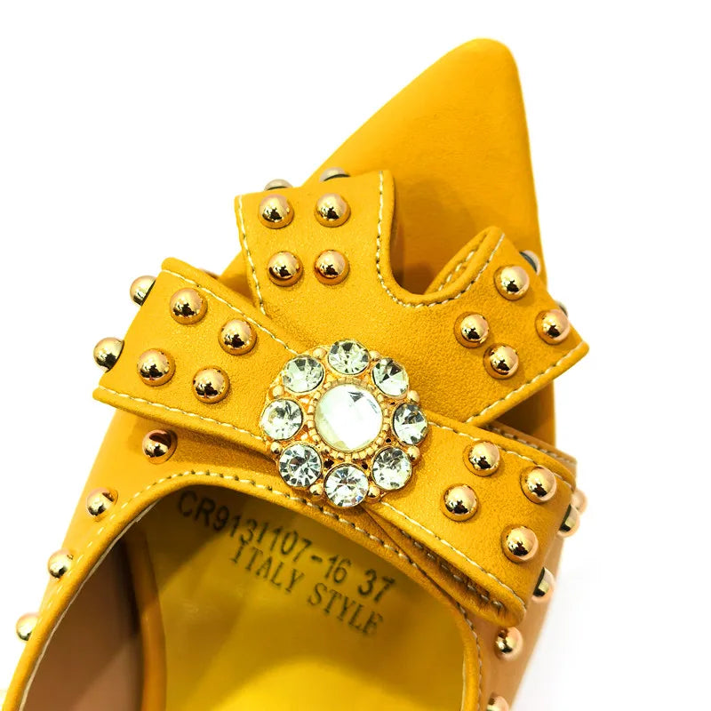 Complete your look with this fashionable women's shoe and bag set, showcasing a trendy rivet pattern for a luxurious appearance.