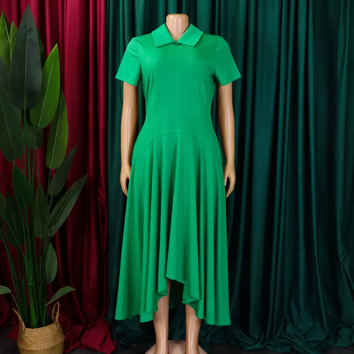 Stylish model showcasing the versatile knee-length evening dress with Peter Pan collar, ideal for office or evening wear.