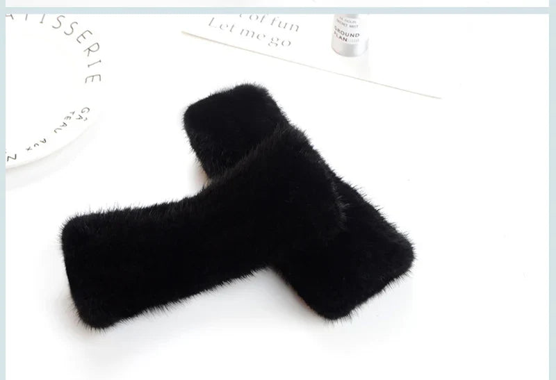 Luxury women's knitted gloves made from 100% real mink fur, featuring half fingers for comfortable typing and a stylish look.
