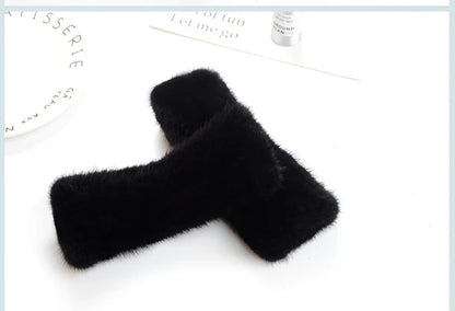 Luxury women's knitted gloves made from 100% real mink fur, featuring half fingers for comfortable typing and a stylish look.