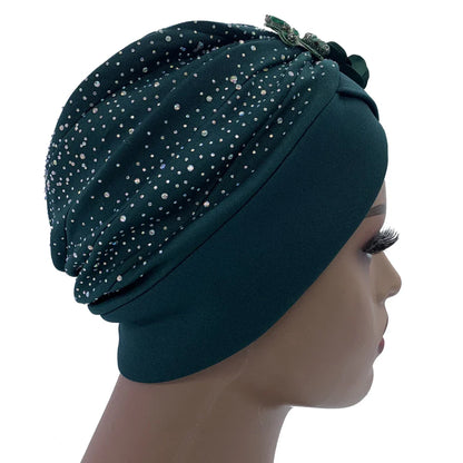 Elegant African turban cap showcasing exquisite rhinestone accents, perfect for stylish women seeking a chic head wrap.