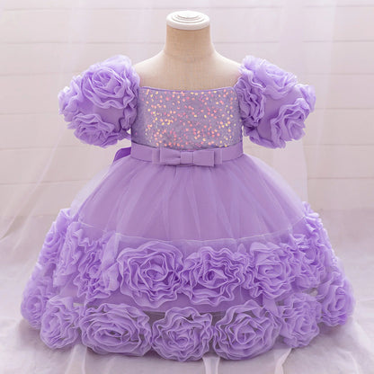 Charming floral appliques adorn this luxurious tulle princess dress for girls aged 4-10, available in several sophisticated colours.