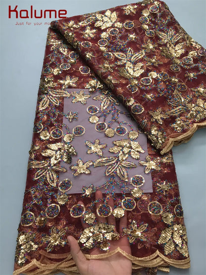 Luxurious Kalume African Lace Fabric with intricate sequins, perfect for elegant party and wedding dress designs, showcasing a stunning mesh texture.