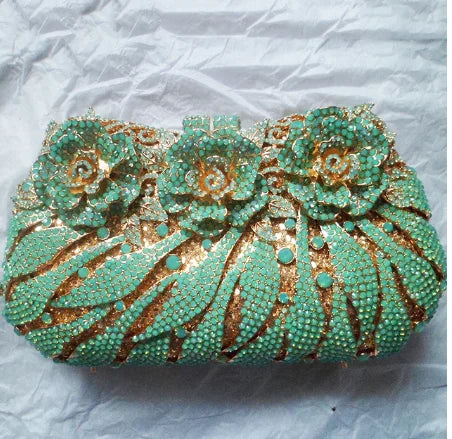 Refined metallic evening clutch purse for women, adorned with rhinestones and designed for upscale parties and celebrations.