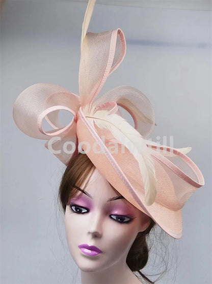 Grey fascinator pillbox cap elegantly styled for women, perfect headpiece for weddings and formal occasions.