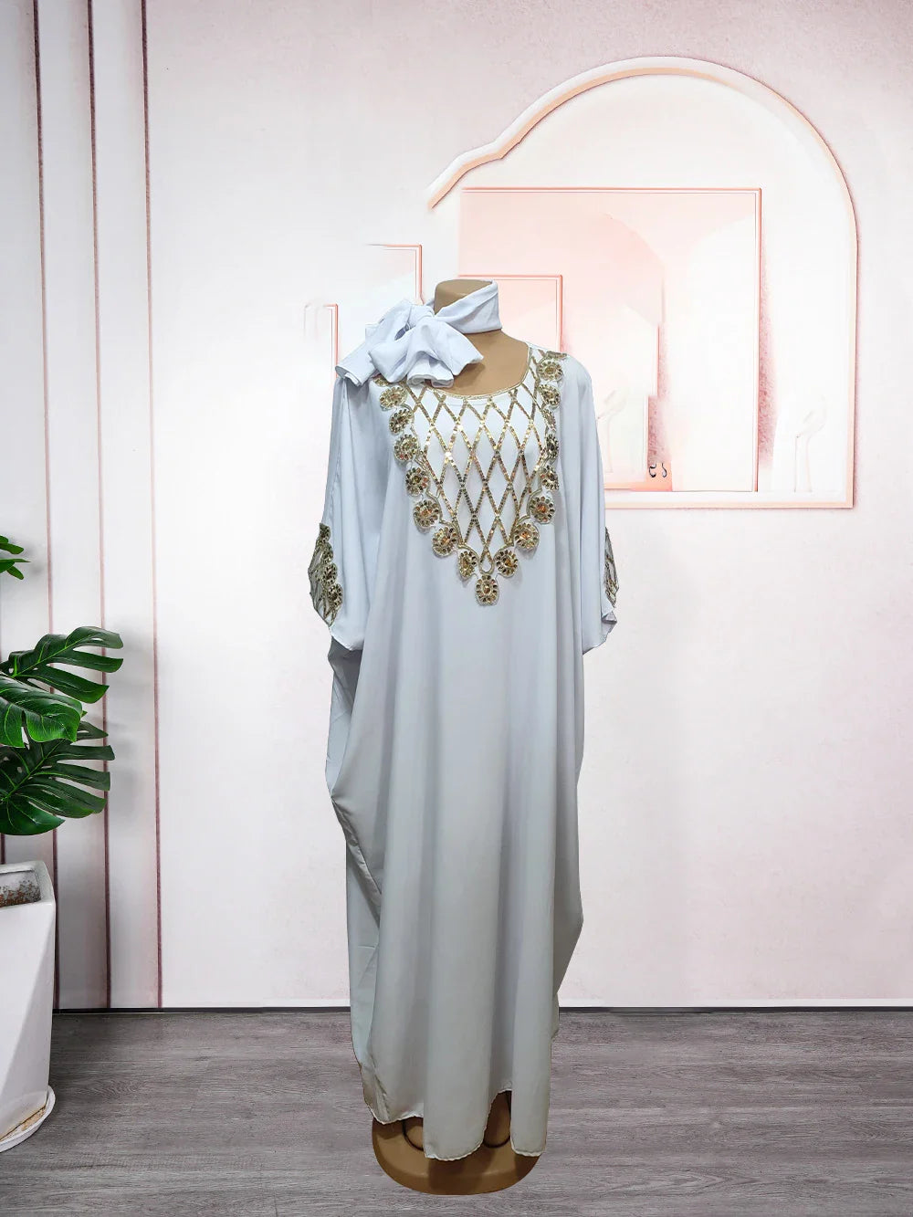 Elegant boubou robe djellaba for women, featuring rich African textile patterns, ideal for special occasions and formal events.