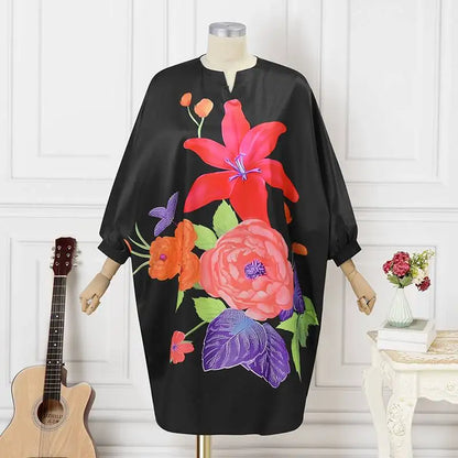 Model wearing the Plus Size 5XL VONDA Women’s Bohemian Floral Midi Dress with batwing sleeves, embodying sophistication and elegance for a summer outing.