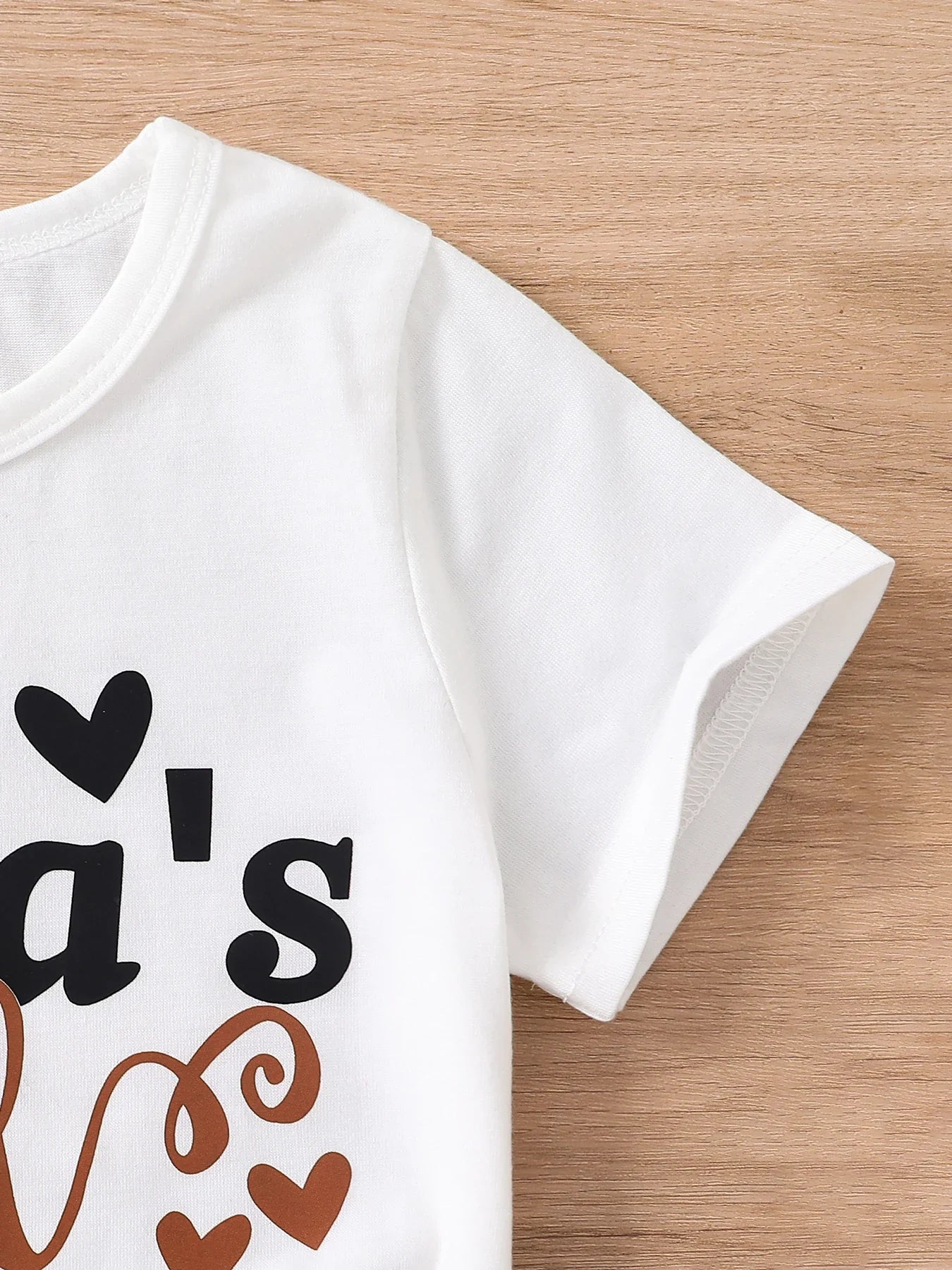 Complete stylish ensemble of a luxury girls' summer 2-piece set, featuring a breathable knitted tee and slim fit shorts, ideal for fashionable young children.