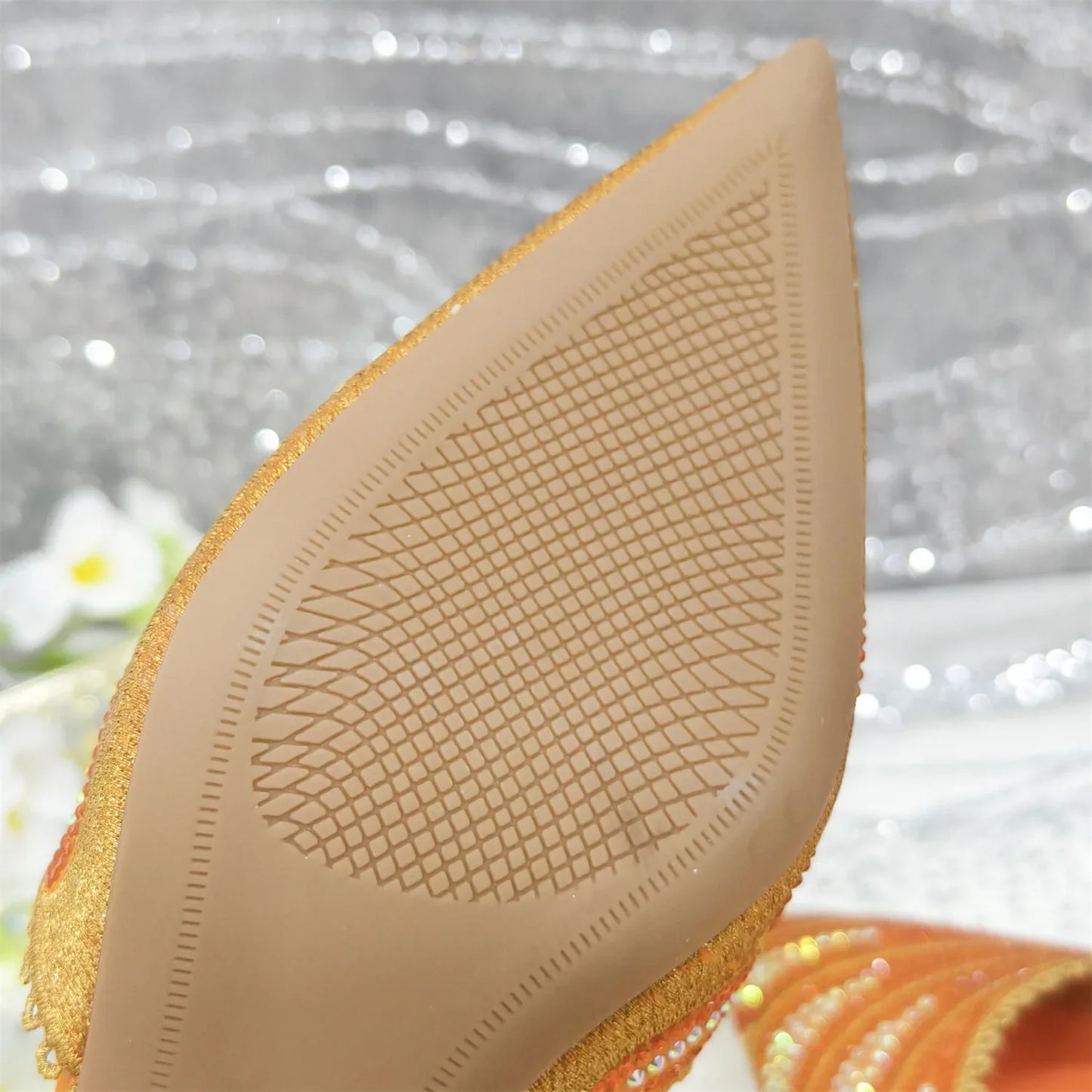 Matching designer handbag featuring a chic metal handle, crafted for elegance to complement diamond studded shoes, ideal for formal events.