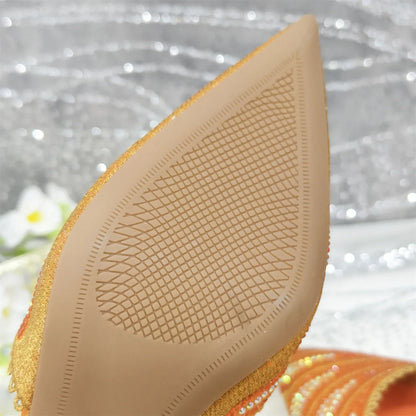 Matching designer handbag featuring a chic metal handle, crafted for elegance to complement diamond studded shoes, ideal for formal events.