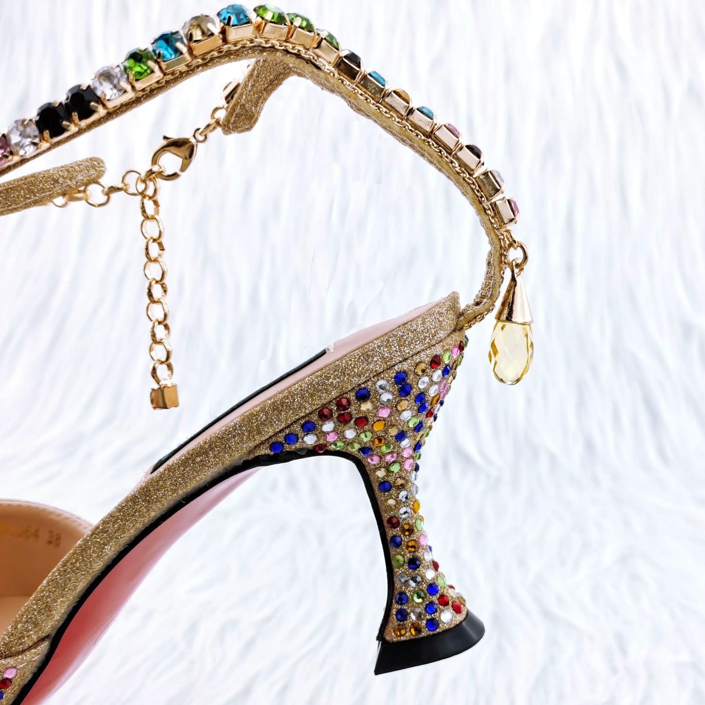 Chic gold high heel pumps adorned with shimmering rhinestones, showcasing a sophisticated style suitable for evening events.