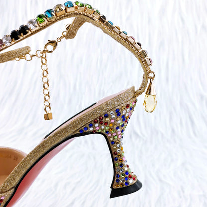 Chic gold high heel pumps adorned with shimmering rhinestones, showcasing a sophisticated style suitable for evening events.