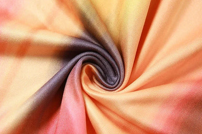 Model wearing the BWQ maxi dress, emphasising its beautiful appliqué decoration and stylish asymmetrical neckline, a must-have for autumn elegance.