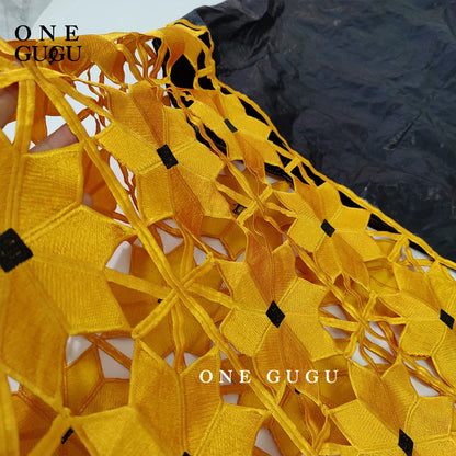 Luxurious long sleeve embroidered gown featuring traditional African craftsmanship and beautiful peach hues.