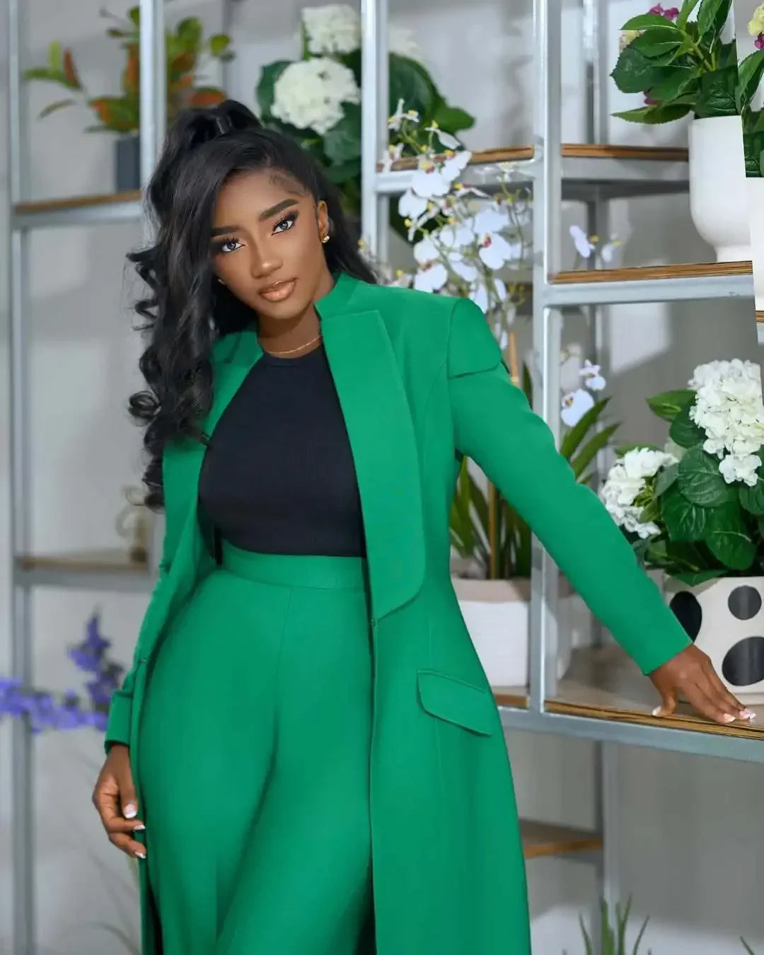 Dramatic close-up of rich polyester fabric of x-long blazer coat, demonstrating medium stretch comfort and timeless style for the contemporary woman.