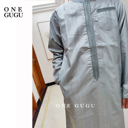 Elegant detail of the blue cotton shirt from the premium African 2-piece men's set, showcasing traditional Nigerian Dashiki patterns, ideal for special occasions.