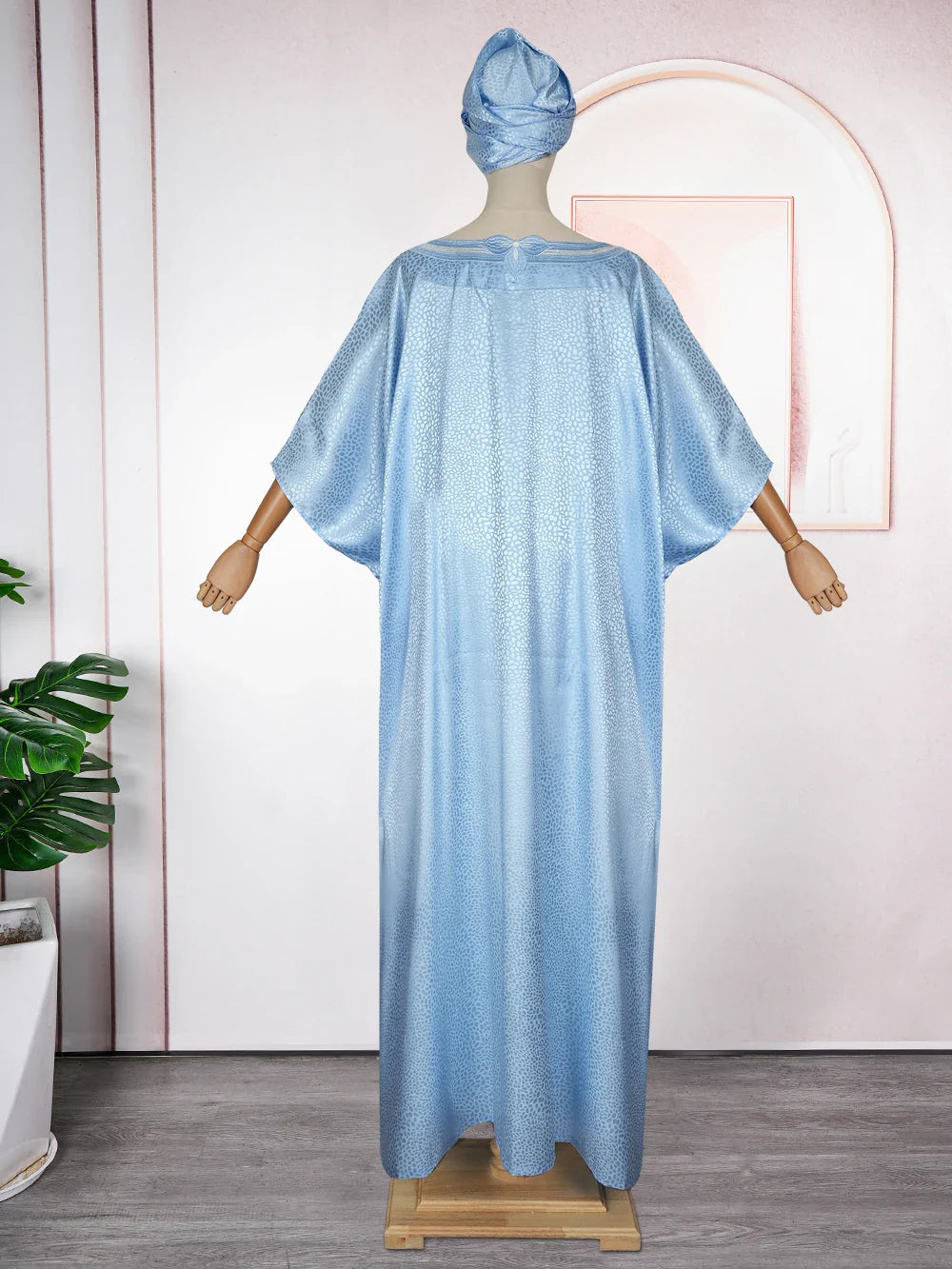 Stunning satin kaftan with intricate embroidery, designed for women who appreciate luxury and elegance in their evening attire.