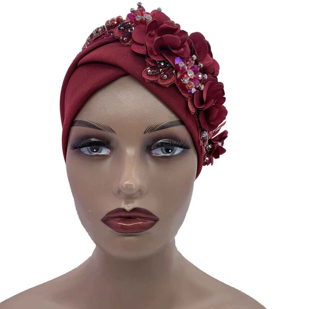 Close-up of an elegant African turban cap, highlighting shimmering rhinestones set on soft polyester fabric, ideal for sophisticated styling.