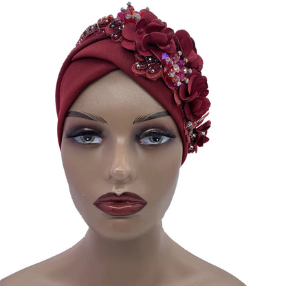 Close-up of an elegant African turban cap, highlighting shimmering rhinestones set on soft polyester fabric, ideal for sophisticated styling.