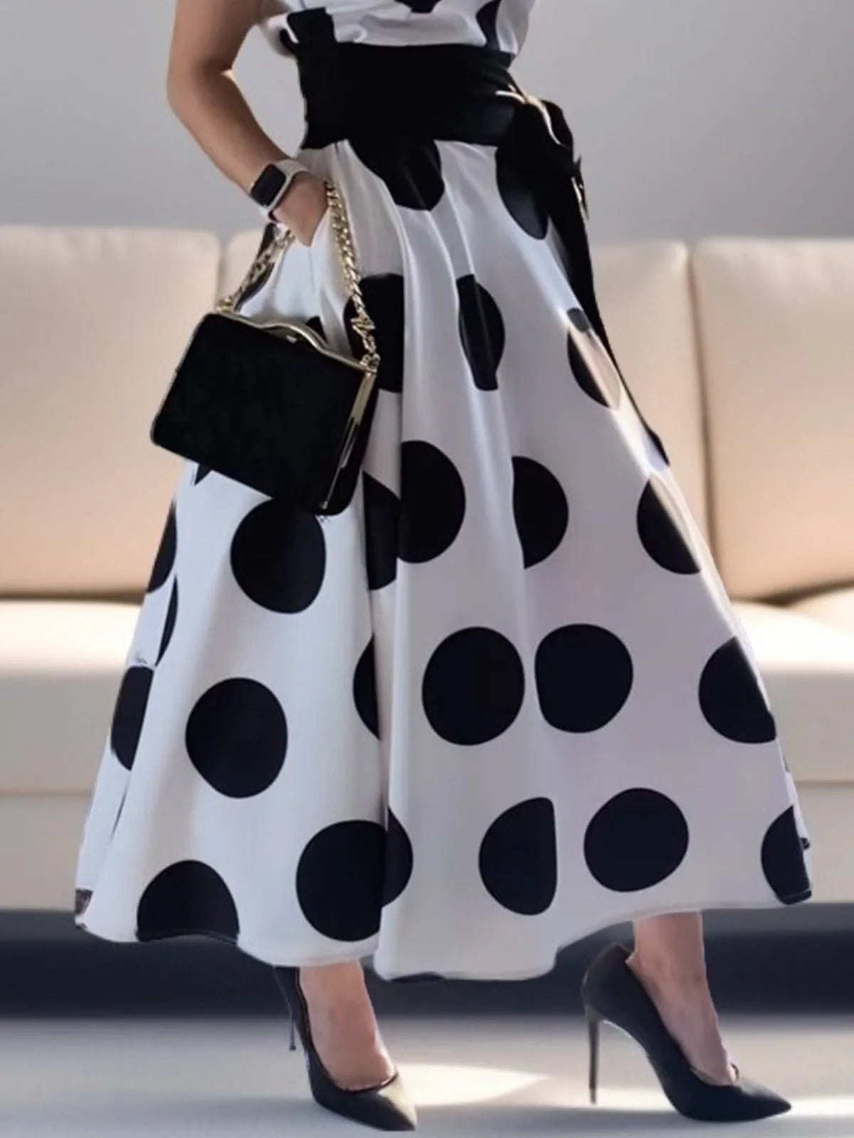 Model showcasing Modigirl Ladies Polka Dots Elegant Dress, perfect for middle-aged women who appreciate fashion and luxury in every detail of their party attire.